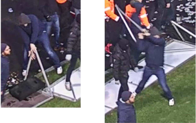 Här syns det tydligt att en av de åtalade sliter loss en del av reklamskylten för att senare kasta mot spelare på plan. Här syns det tydligt att en av de åtalade sliter loss en del av reklamskylten för att senare kasta mot spelare på plan.